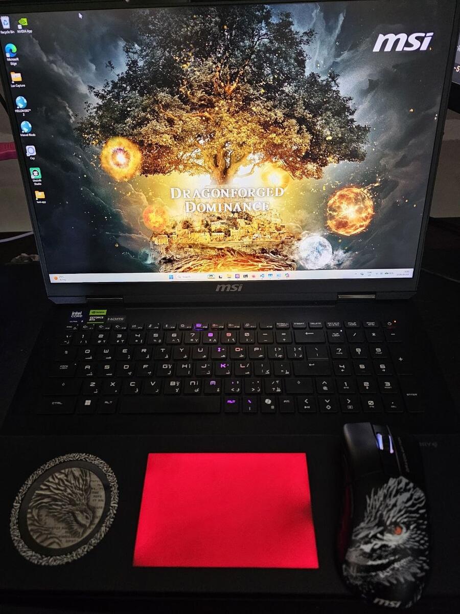 Open MSI Titan Dragon Edition laptop with its matching accessories